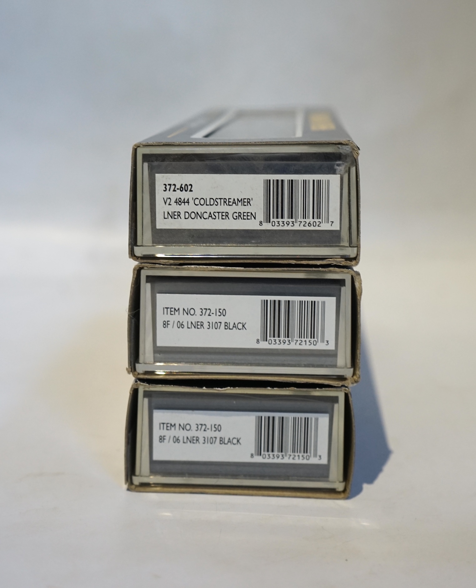 Three boxed Graham Farish N gauge railway LNER tender locomotives; a Class 8F, 3107 (372-150), a Class 8F, 3107 (372-150), and a Class V2, 4844 (372-602). Condition - good.